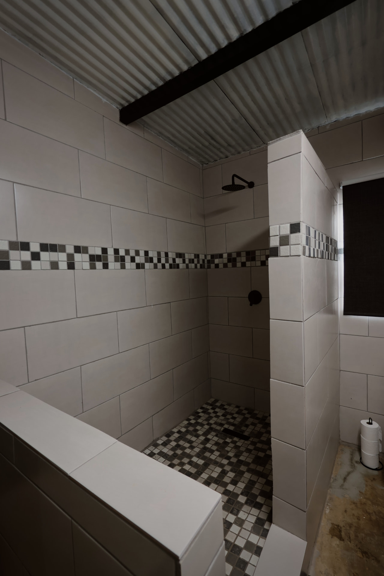 Tiled walk in rain shower in the guest bathroom