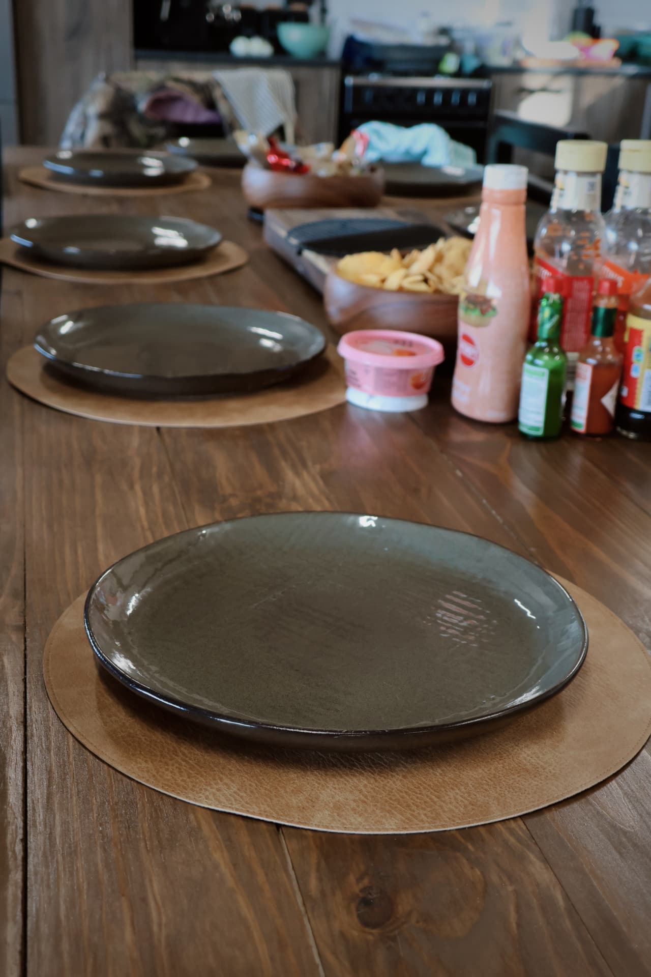 Long dining table set with stoneware plates