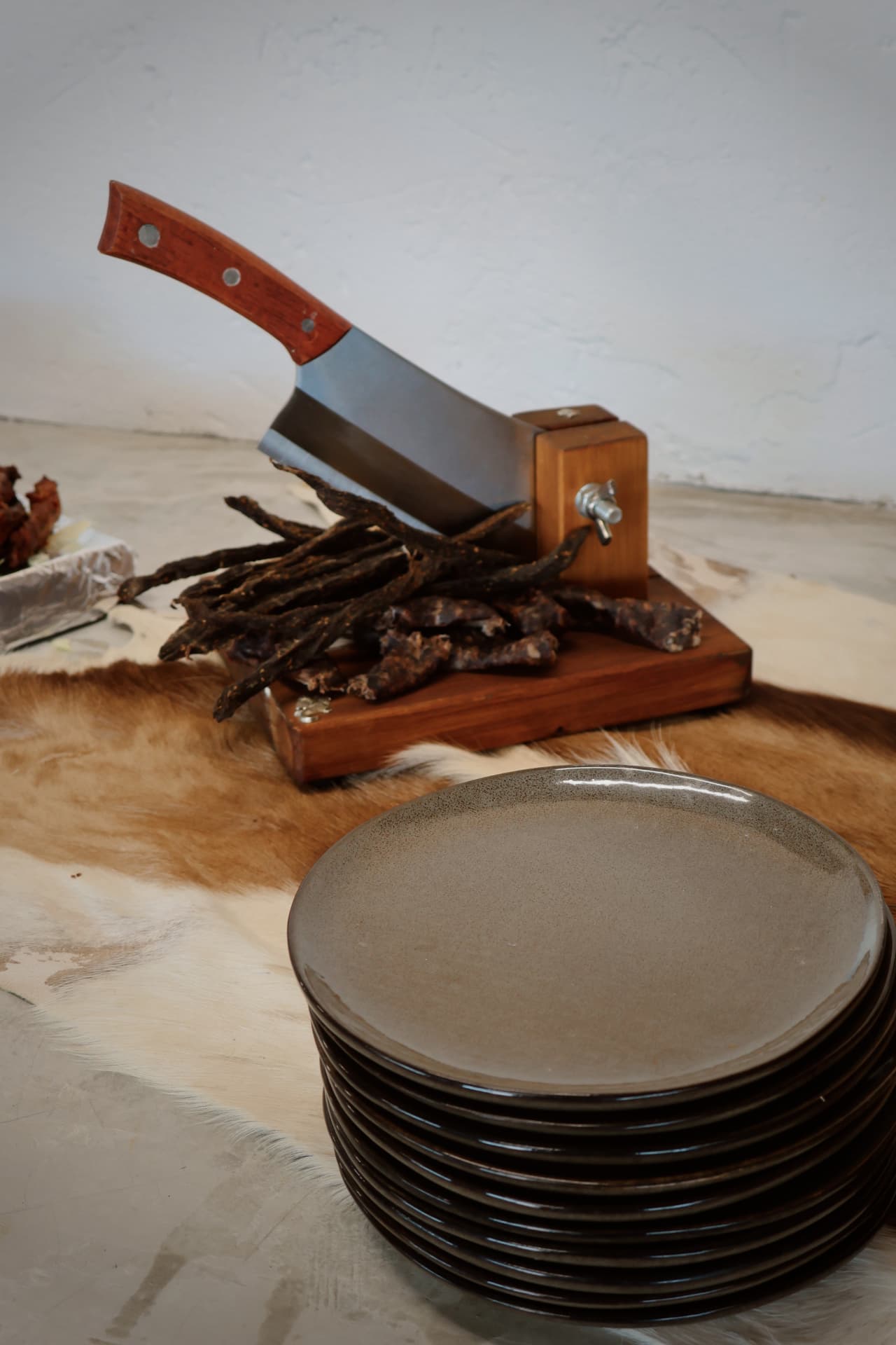 Biltong board with cutter and cheese in the lapa