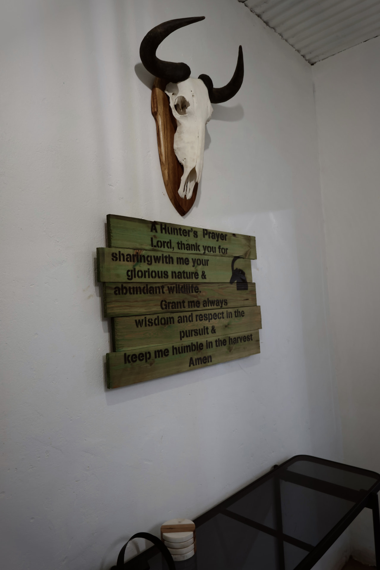 Hunter's prayer plaque and skull mount in the lapa