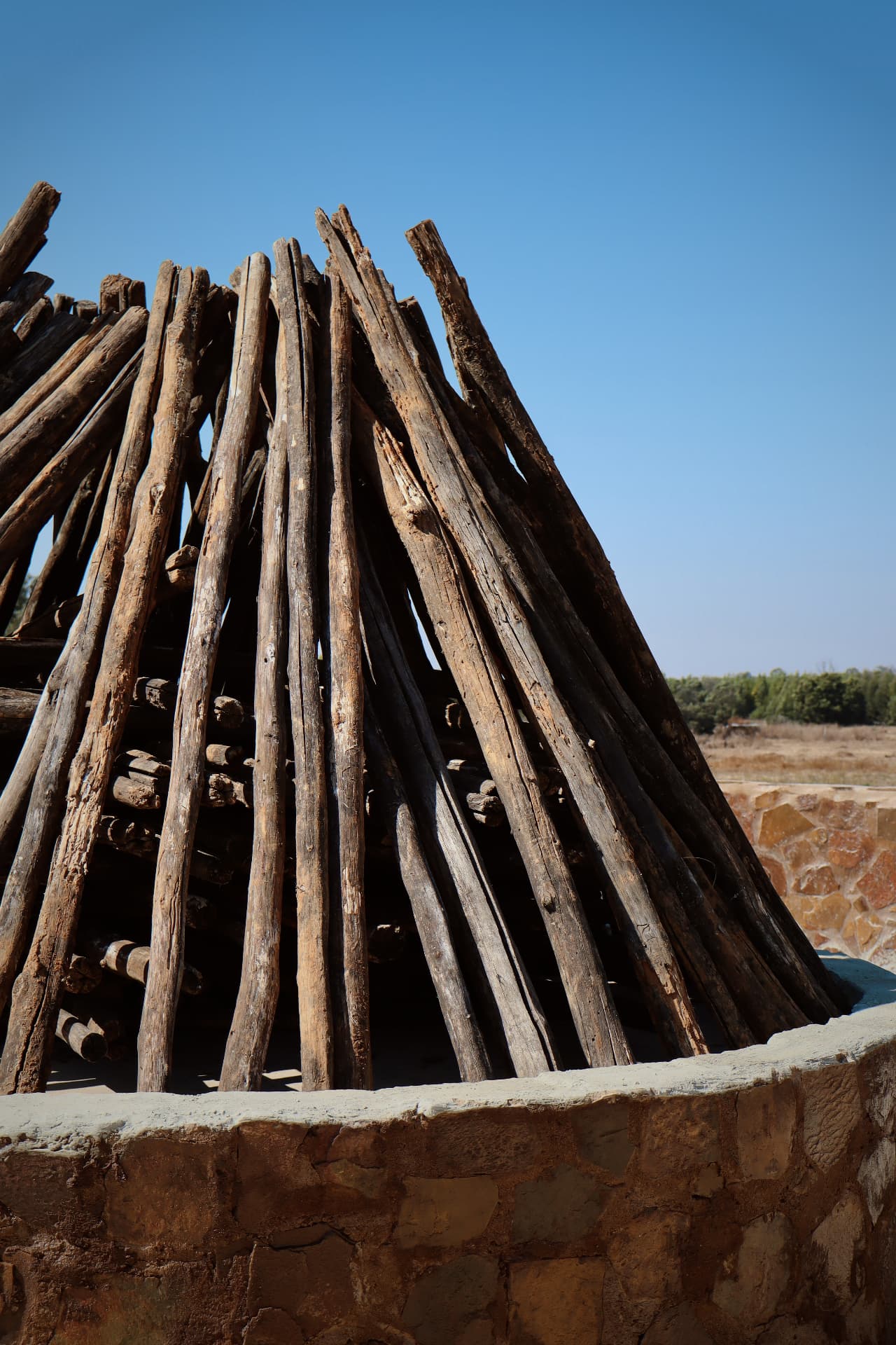 Timber stacked and ready in the fire pit