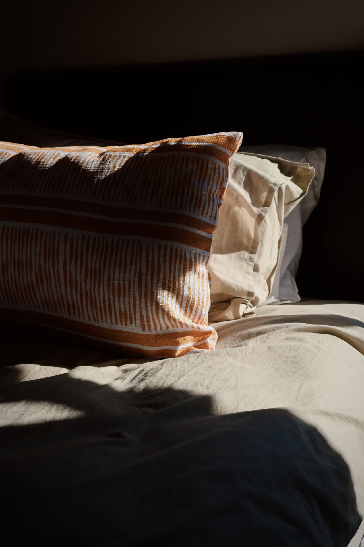 Morning light across the bed linen