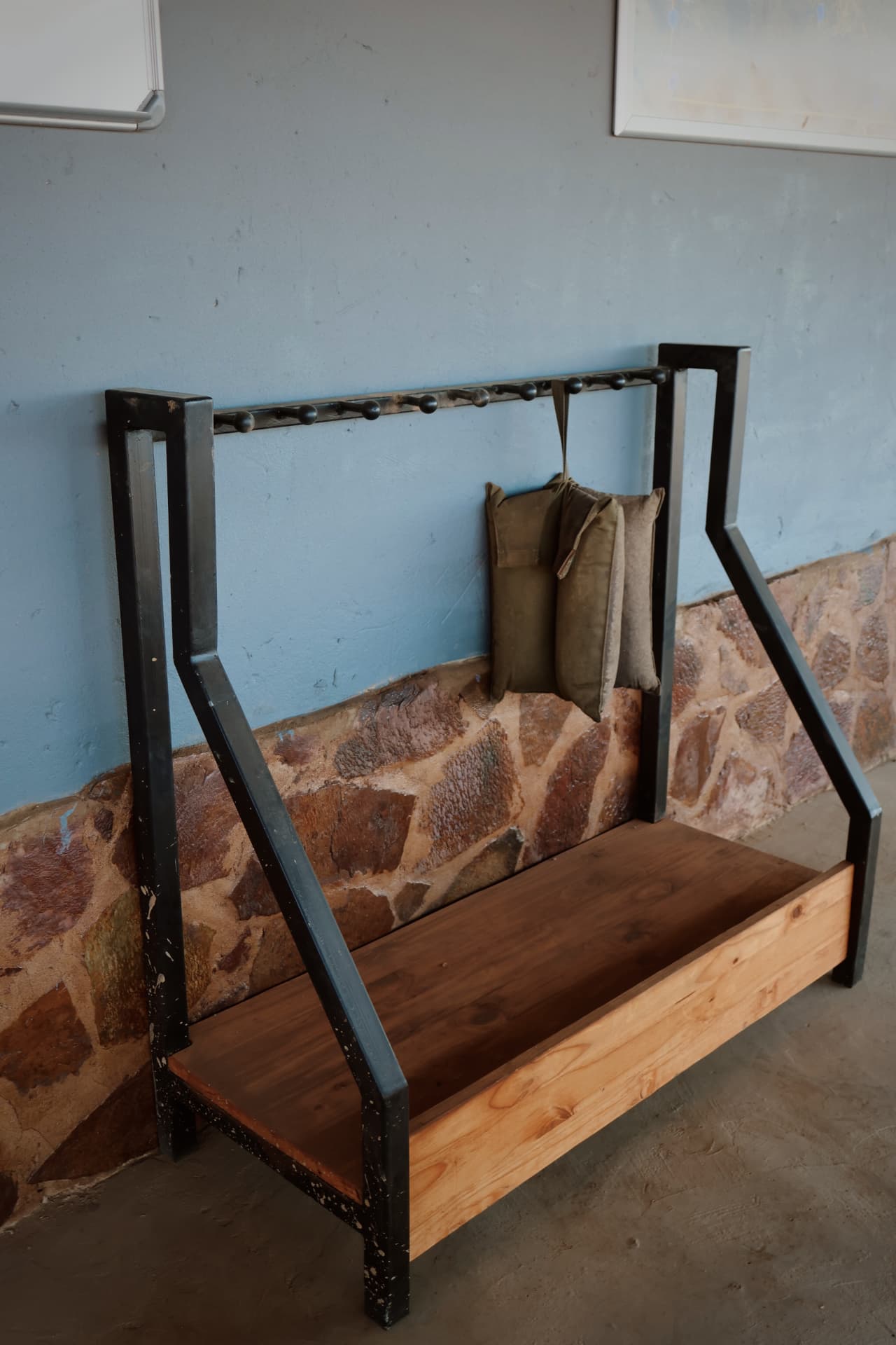 Steel and wood rifle rack at the lodge entrance