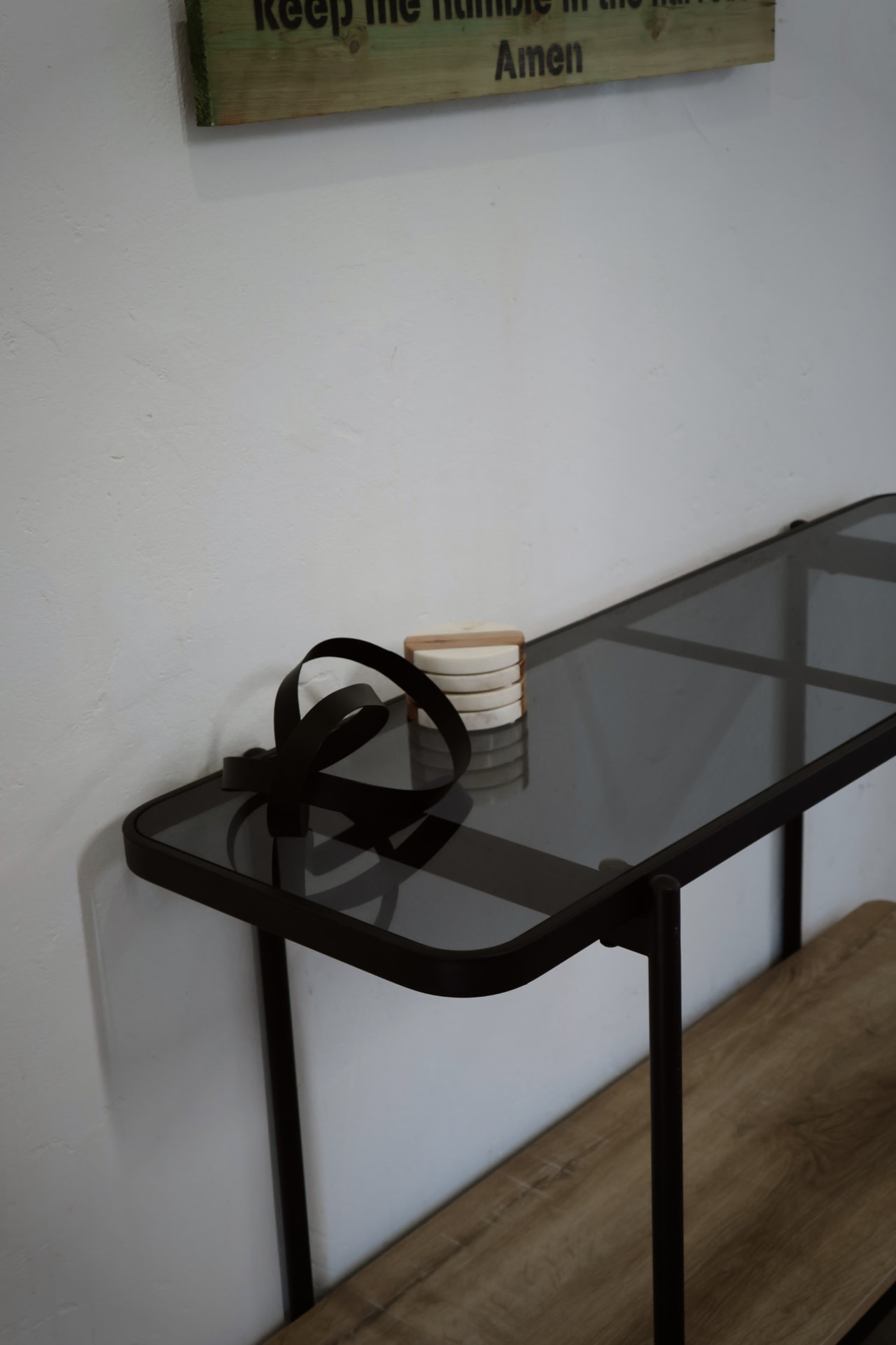 Console table with coasters below the hunter's prayer