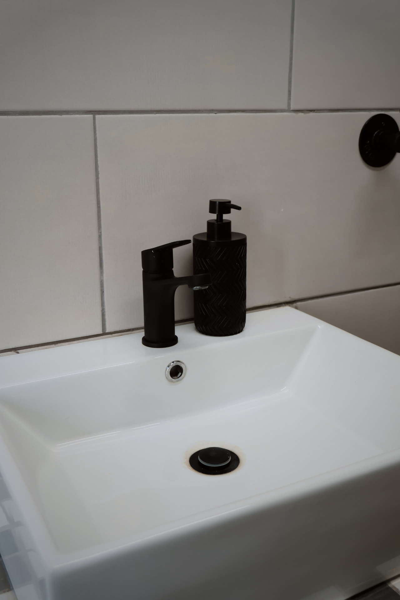 Guest basin with matte black tap and hand wash